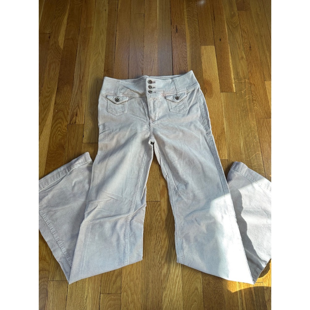 Women's Anthropology corduroy cream pants with a small stain on the leg